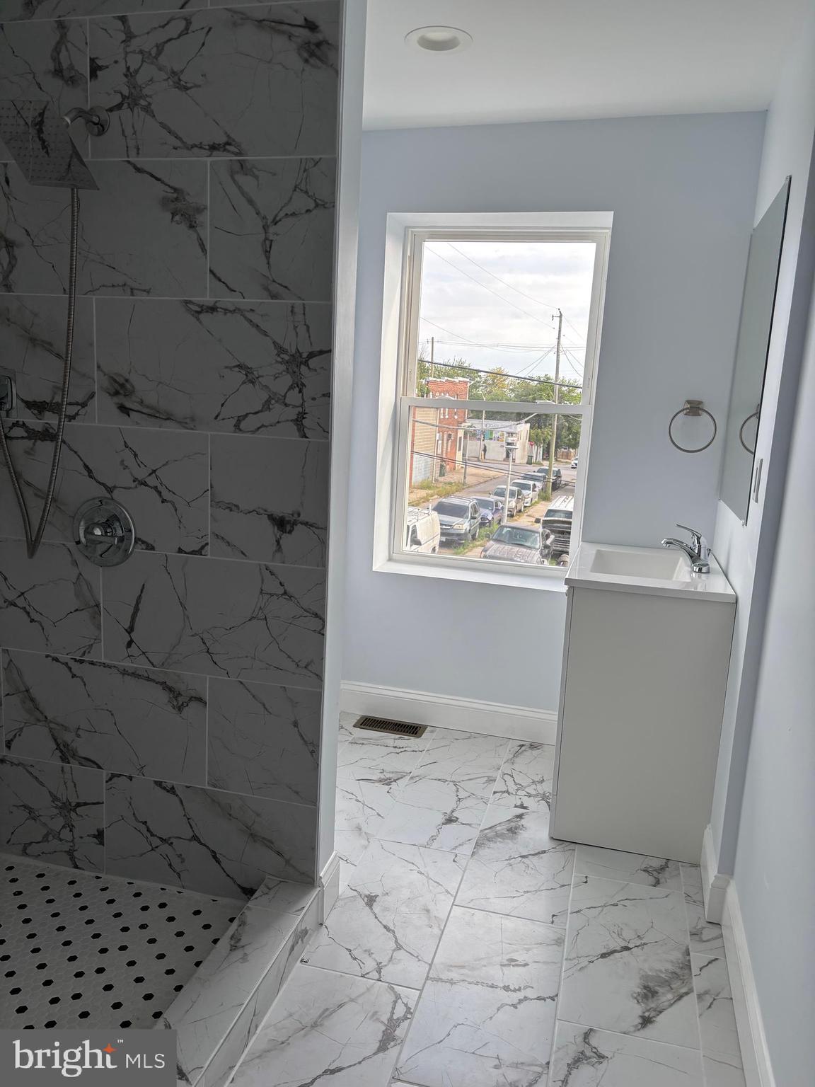 2505 Federal Street Baltimore, MD 21213 - Photo 13 of 26 a bathroom with a sink a toilet and a window