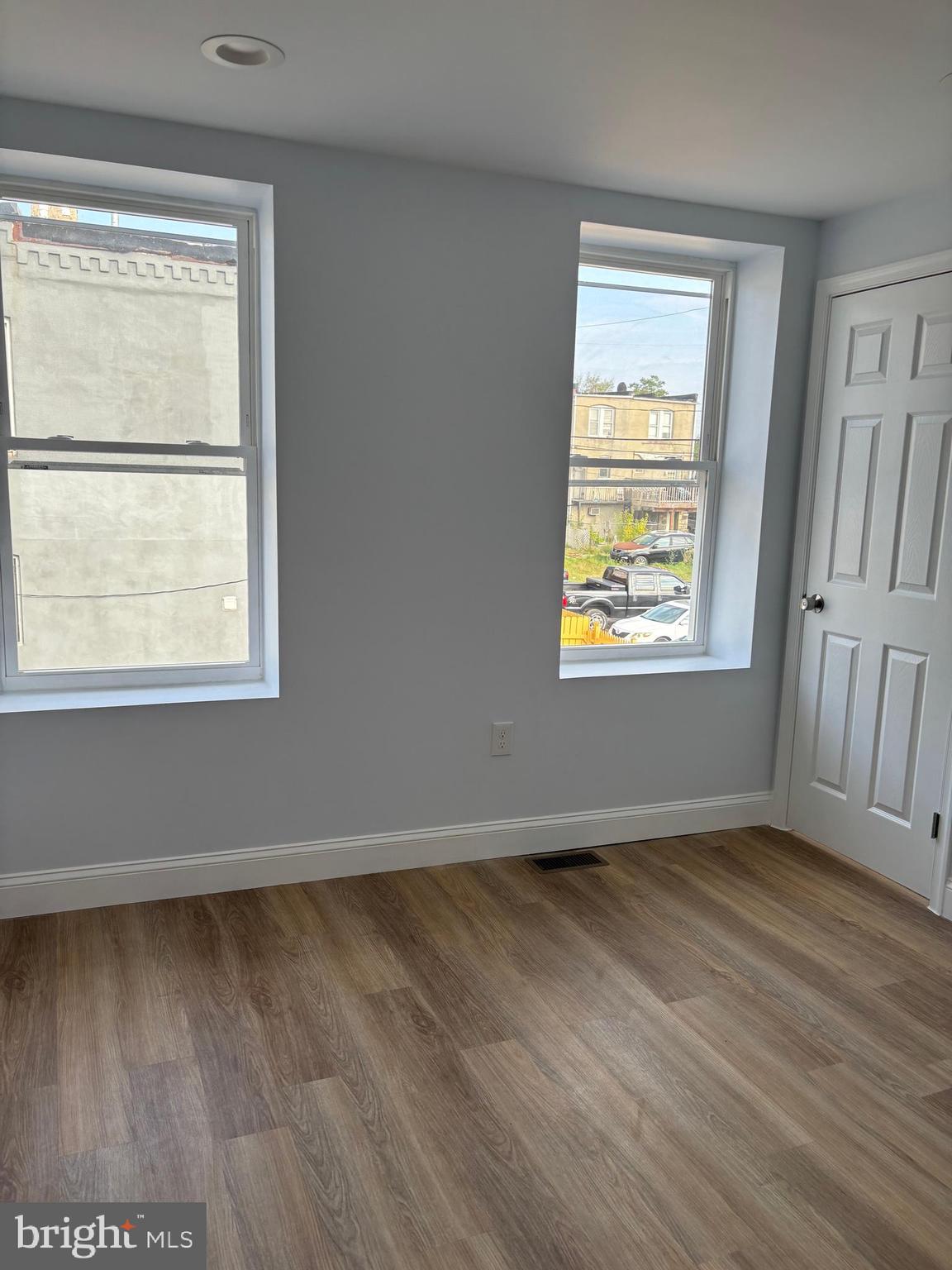 2505 Federal Street Baltimore, MD 21213 - Photo 14 of 26 a view of an empty room with wooden floor and a window