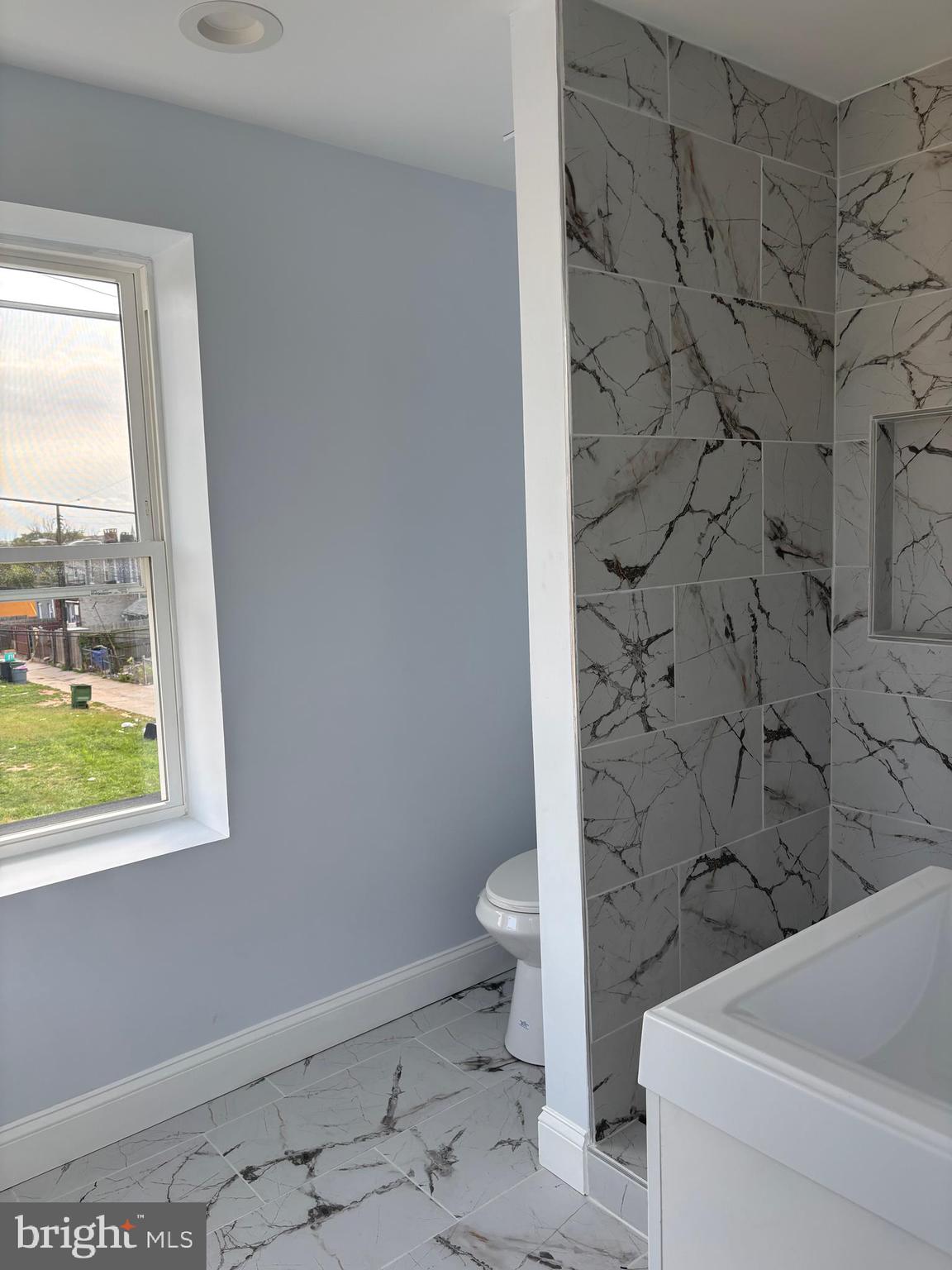 2505 Federal Street Baltimore, MD 21213 - Photo 15 of 26 a bathroom with a toilet and a shower