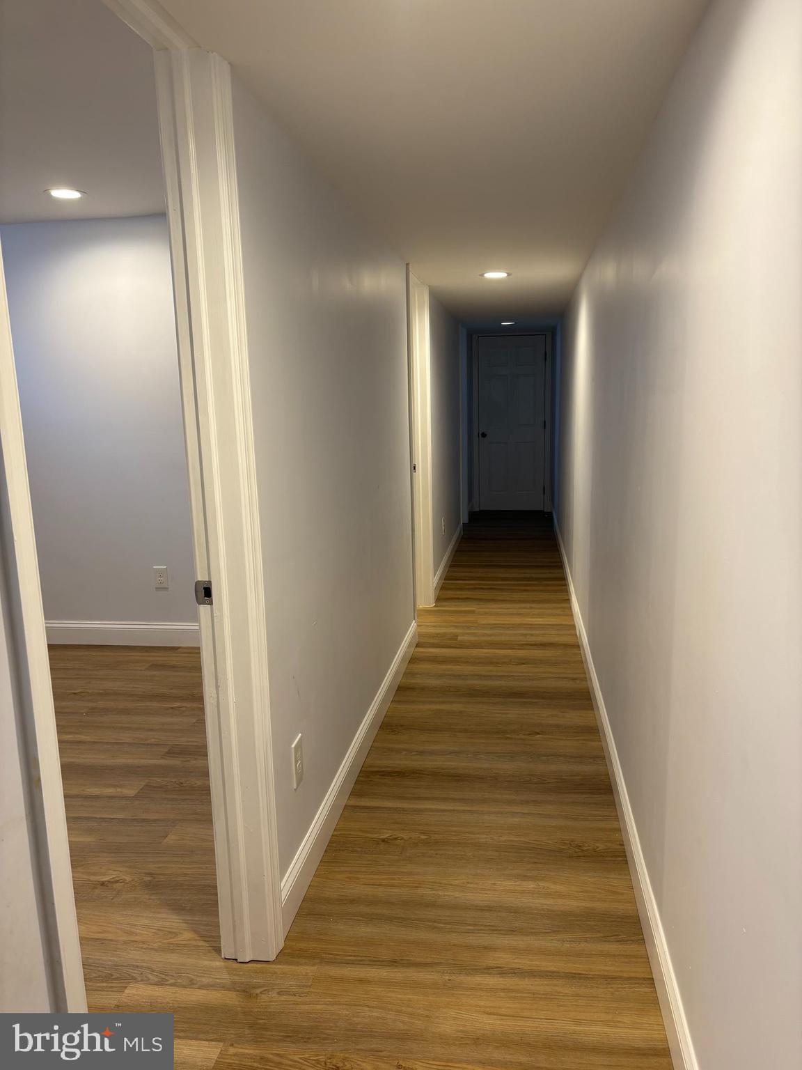 2505 Federal Street Baltimore, MD 21213 - Photo 25 of 26 a view of a hallway with wooden floor and stairs