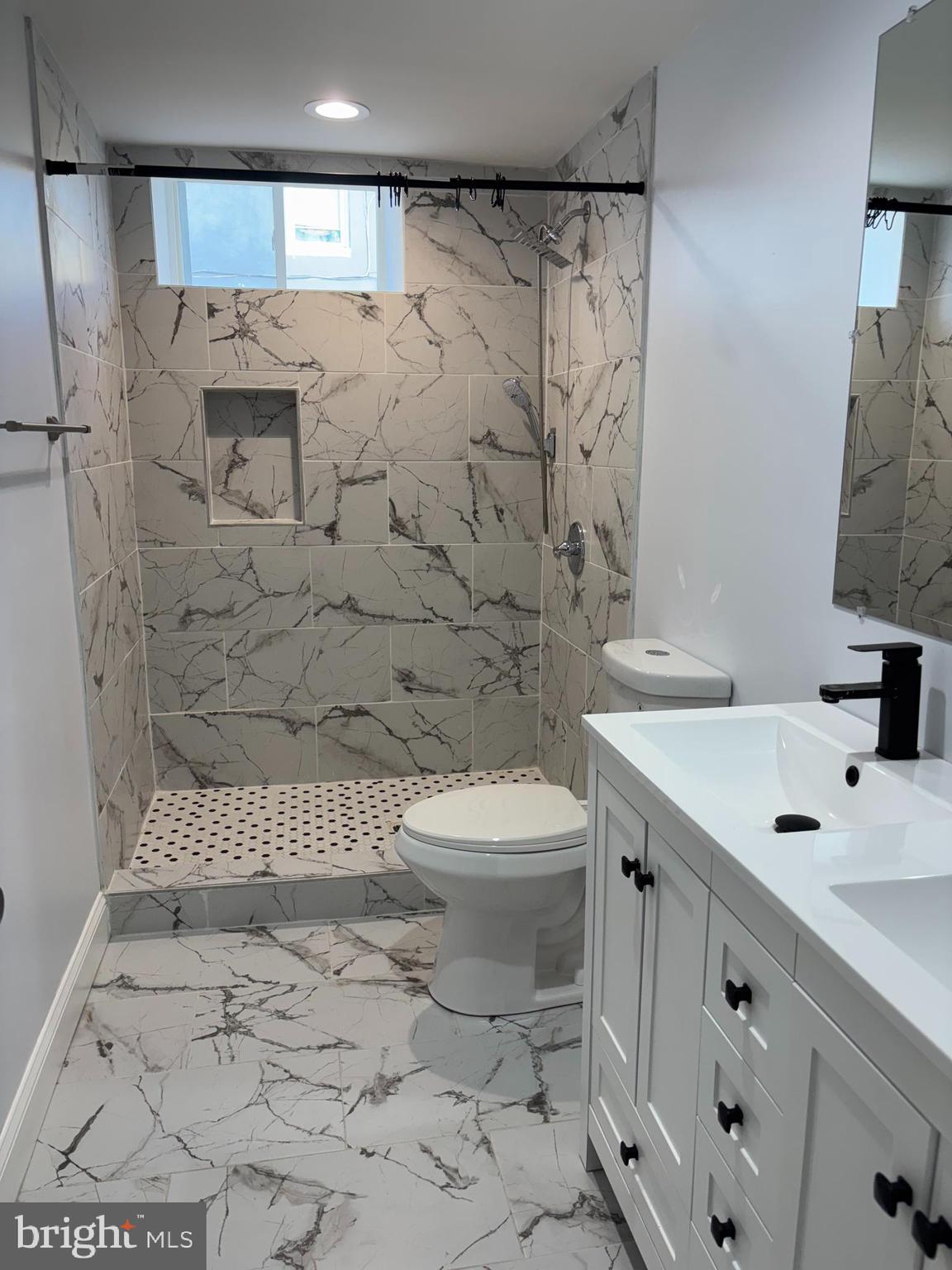 2505 Federal Street Baltimore, MD 21213 - Photo 26 of 26 a bathroom with a sink toilet and shower