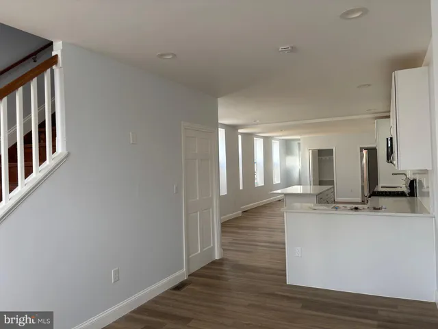 a view of a kitchen from the hallway