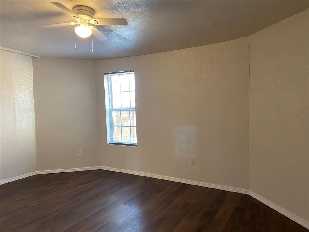 12115 Segrest Drive Houston, TX 77047 - Photo 11 of 13 a view of an empty room with wooden floor and a window