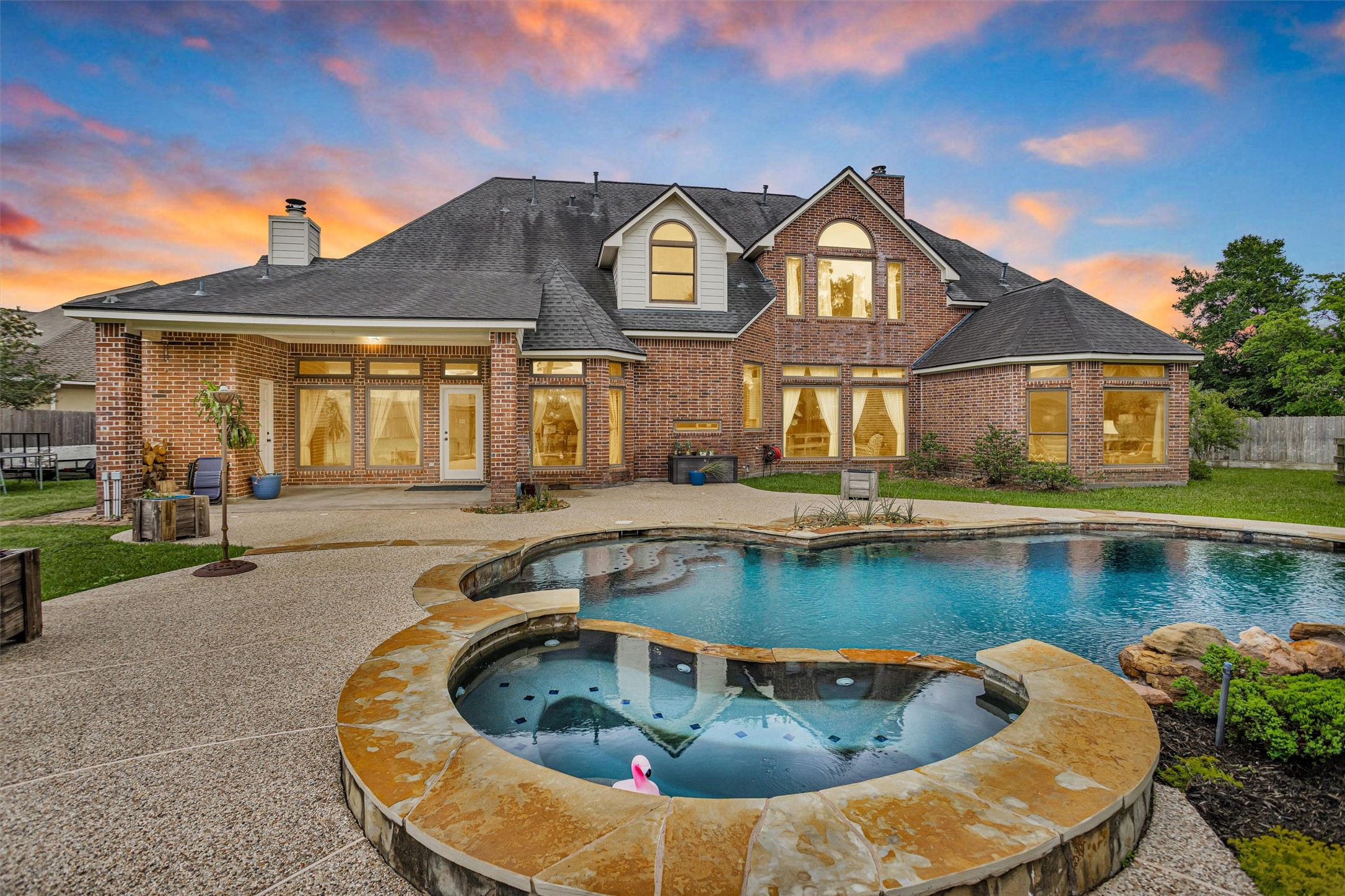 8314 Drew Haven Lane Spring, TX 77379 - Photo 2 of 49 This stunning brick home features a beautifully landscaped backyard with a luxurious pool and spa.