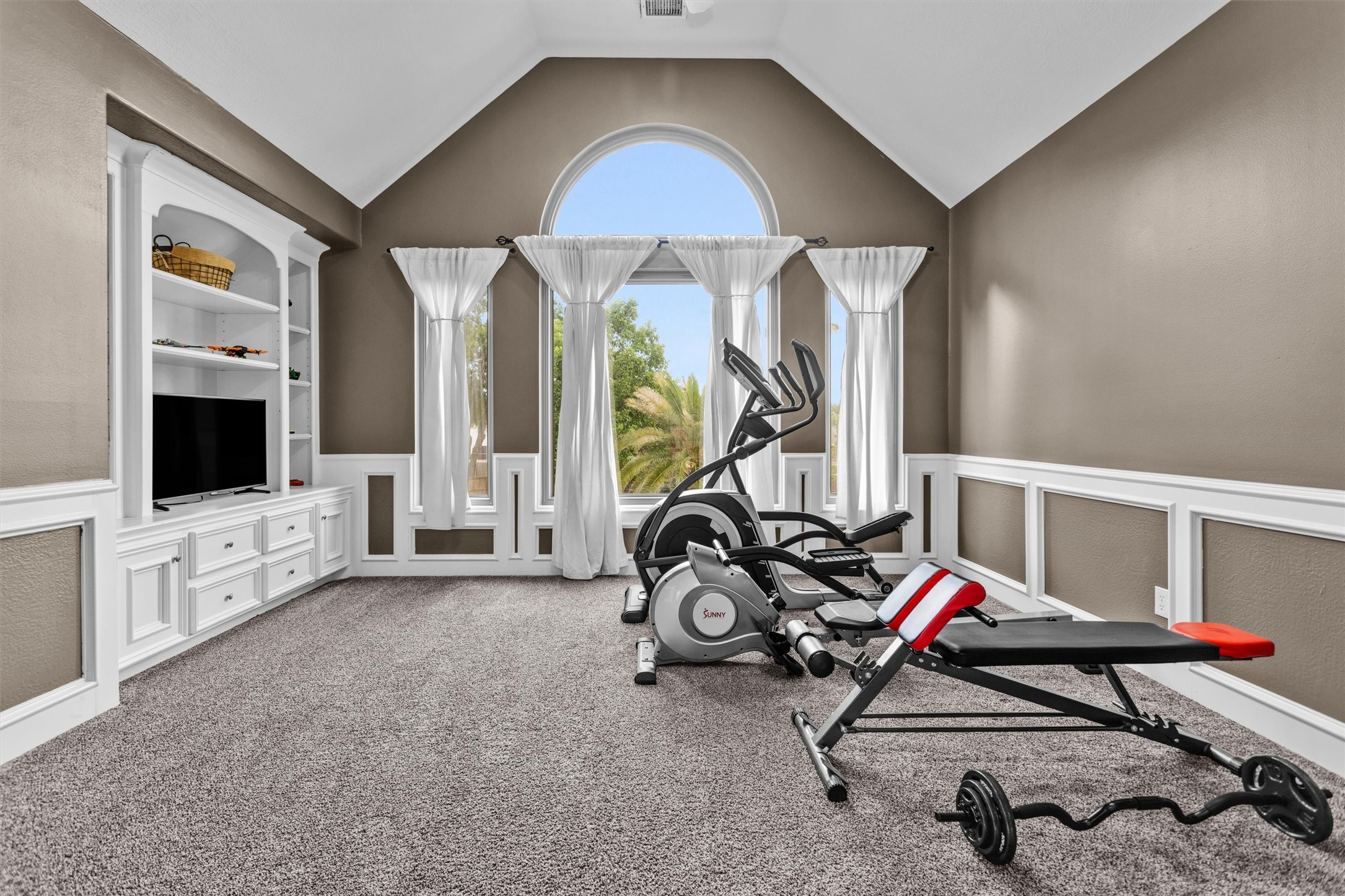 8314 Drew Haven Lane Spring, TX 77379 - Photo 31 of 49 Currently set up as a home gym, making it a versatile space for relaxation, exercise, media room, or 5th bedroom.
