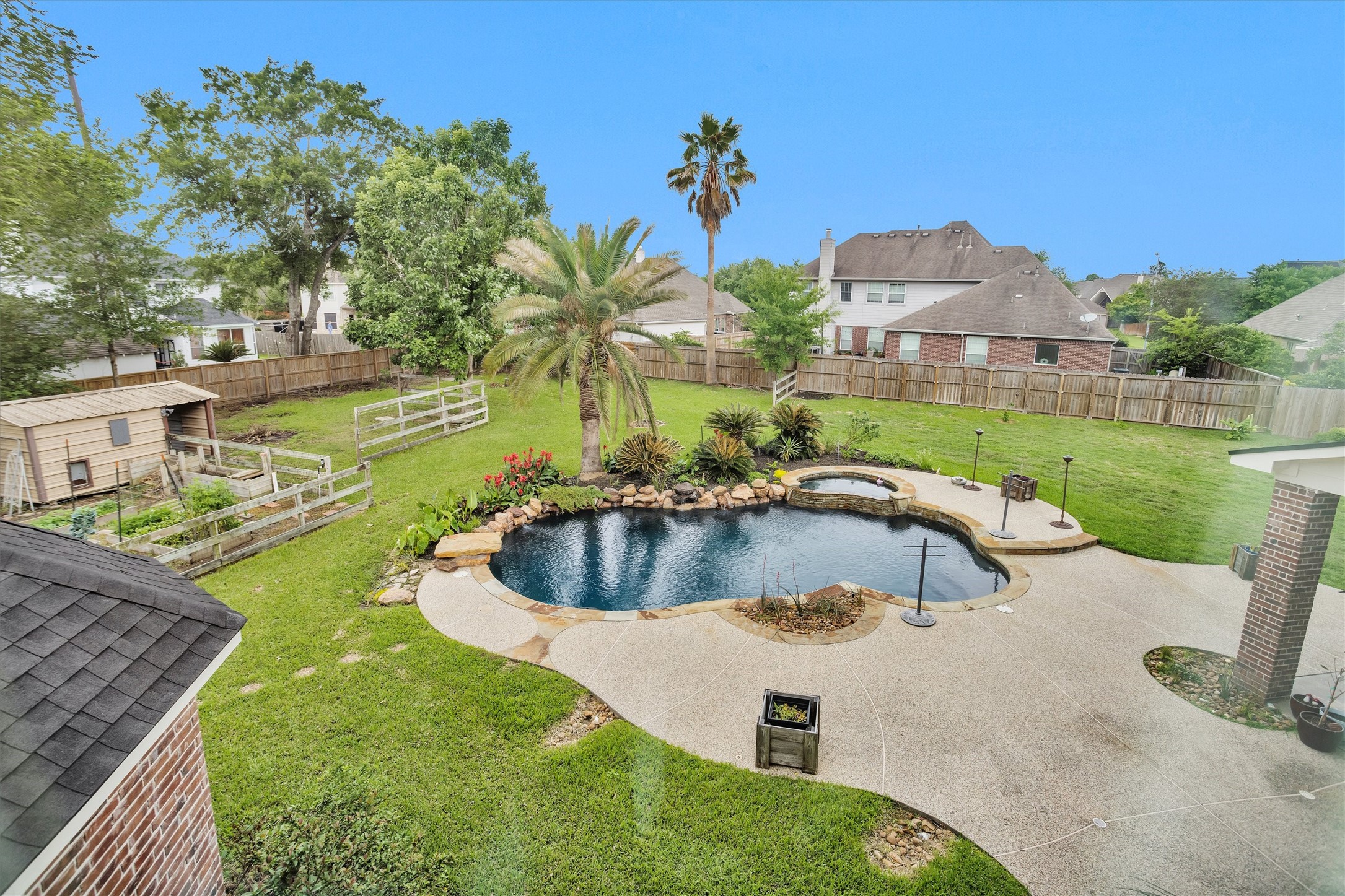 8314 Drew Haven Lane Spring, TX 77379 - Photo 33 of 49 This backyard view from upstairs lets you take in the large, spacious back yard and beautiful pool/spa.