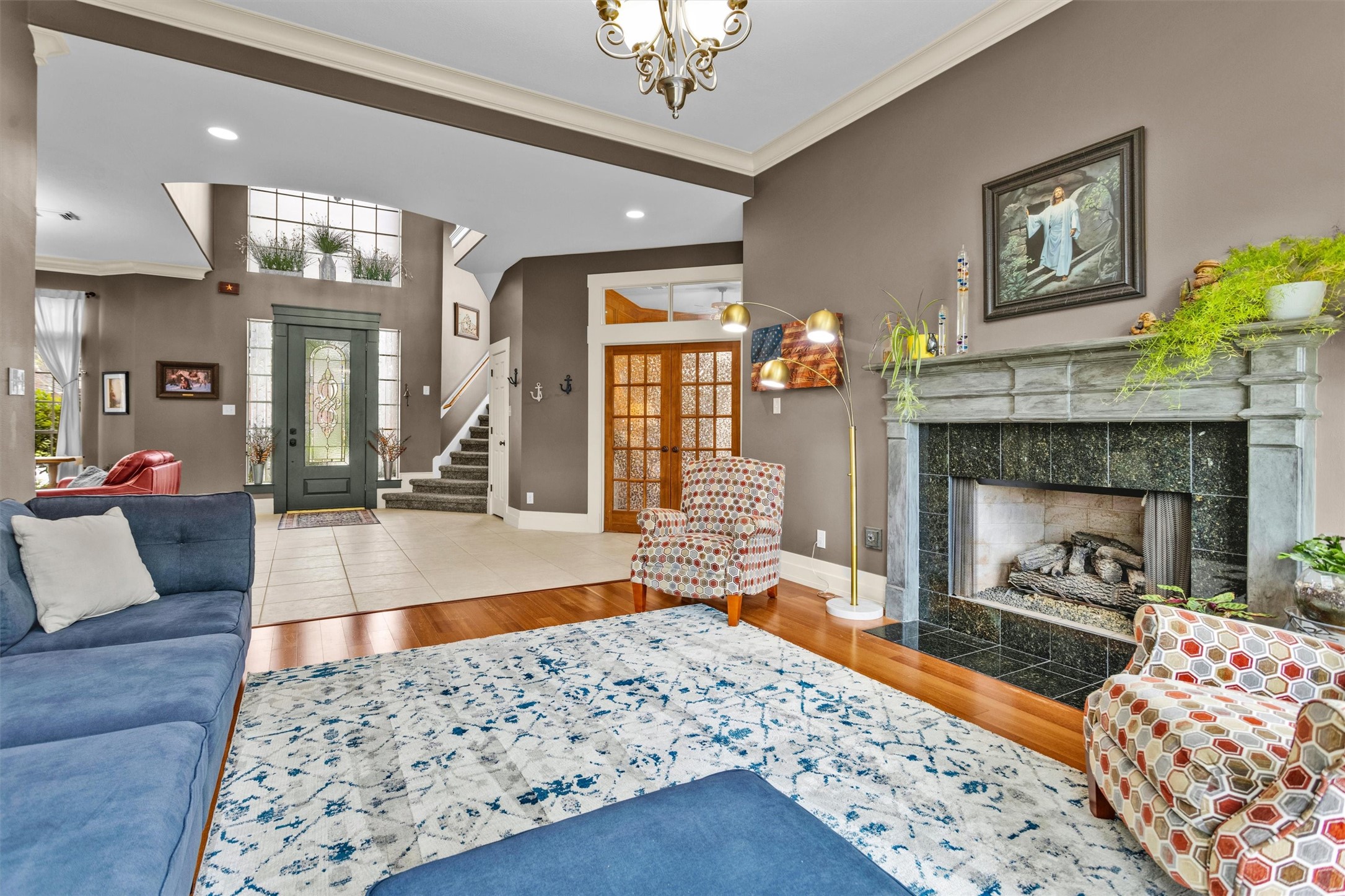 8314 Drew Haven Lane Spring, TX 77379 - Photo 9 of 49 This inviting living space features a stylish fireplace and beautiful floors.