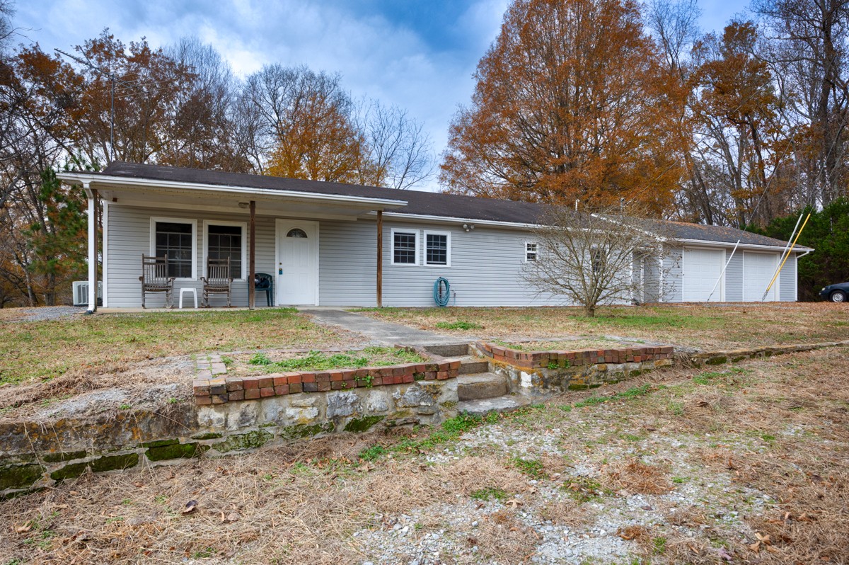 560 Old Poplar School Road Prospect, TN 38477 - Photo 1 of 28 a view of a house with backyard and trees