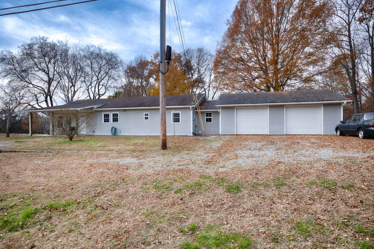560 Old Poplar School Road Prospect, TN 38477 - Photo 14 of 28 a view of a house with a yard and garage