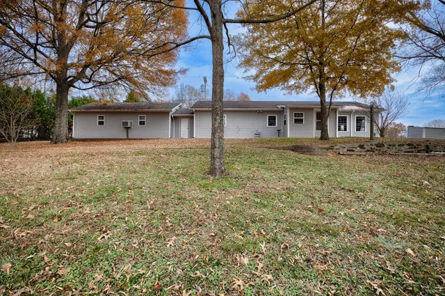 a house with trees in front of it