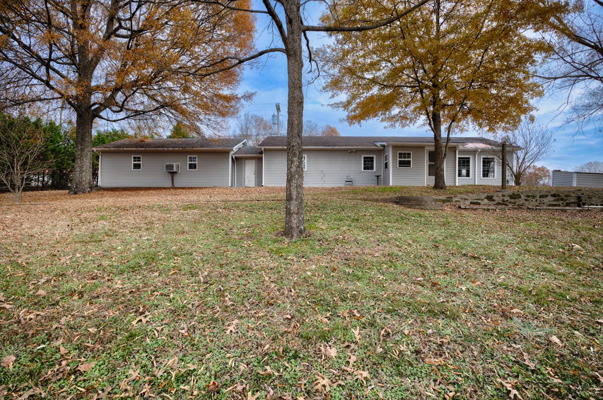 560 Old Poplar School Road Prospect, TN 38477 - Photo 16 of 28 a house with trees in front of it