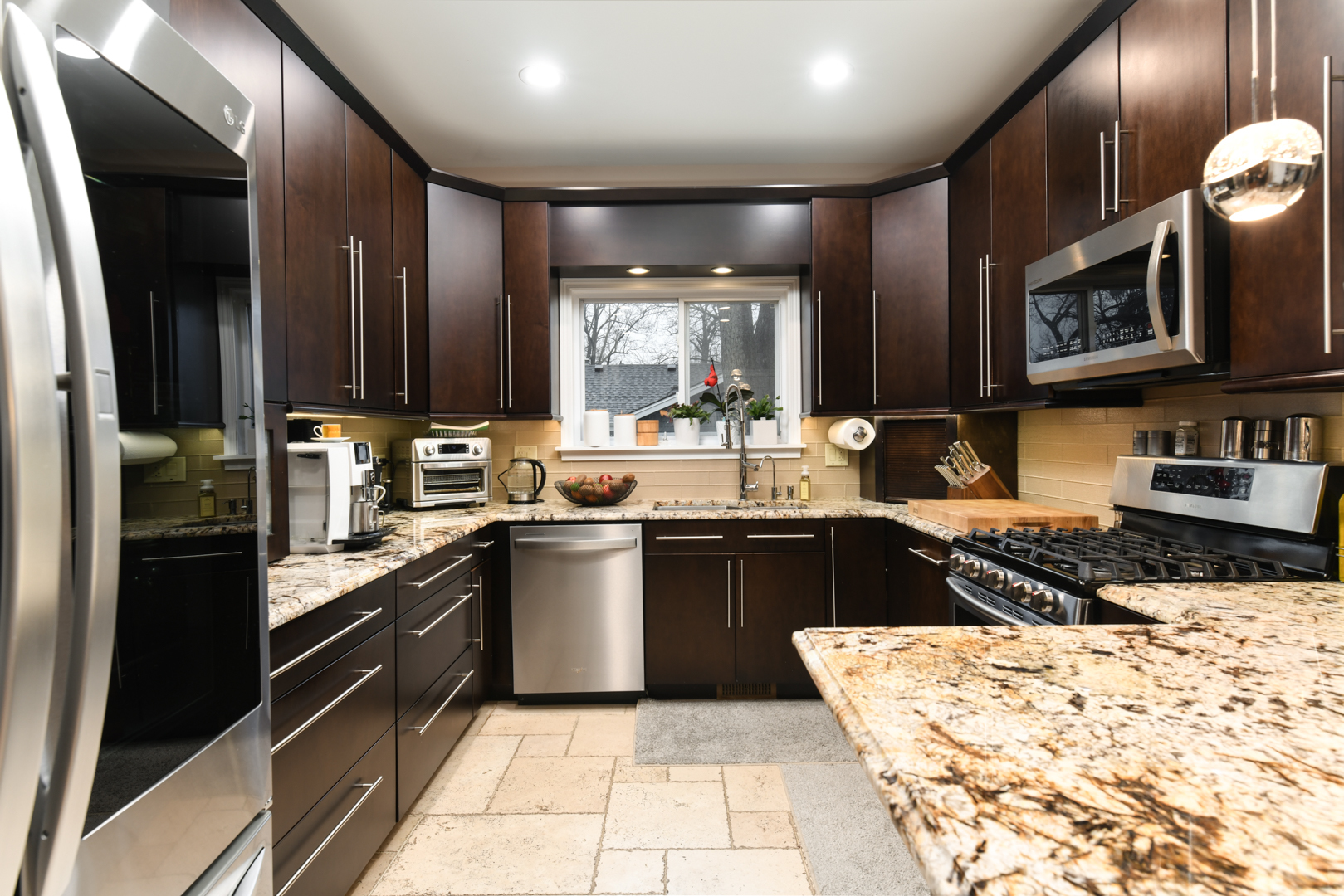 111 Grace Lane Fox River Grove, IL 60021 - Photo 13 of 33 a kitchen with stainless steel appliances kitchen island granite countertop a sink stove and refrigerator