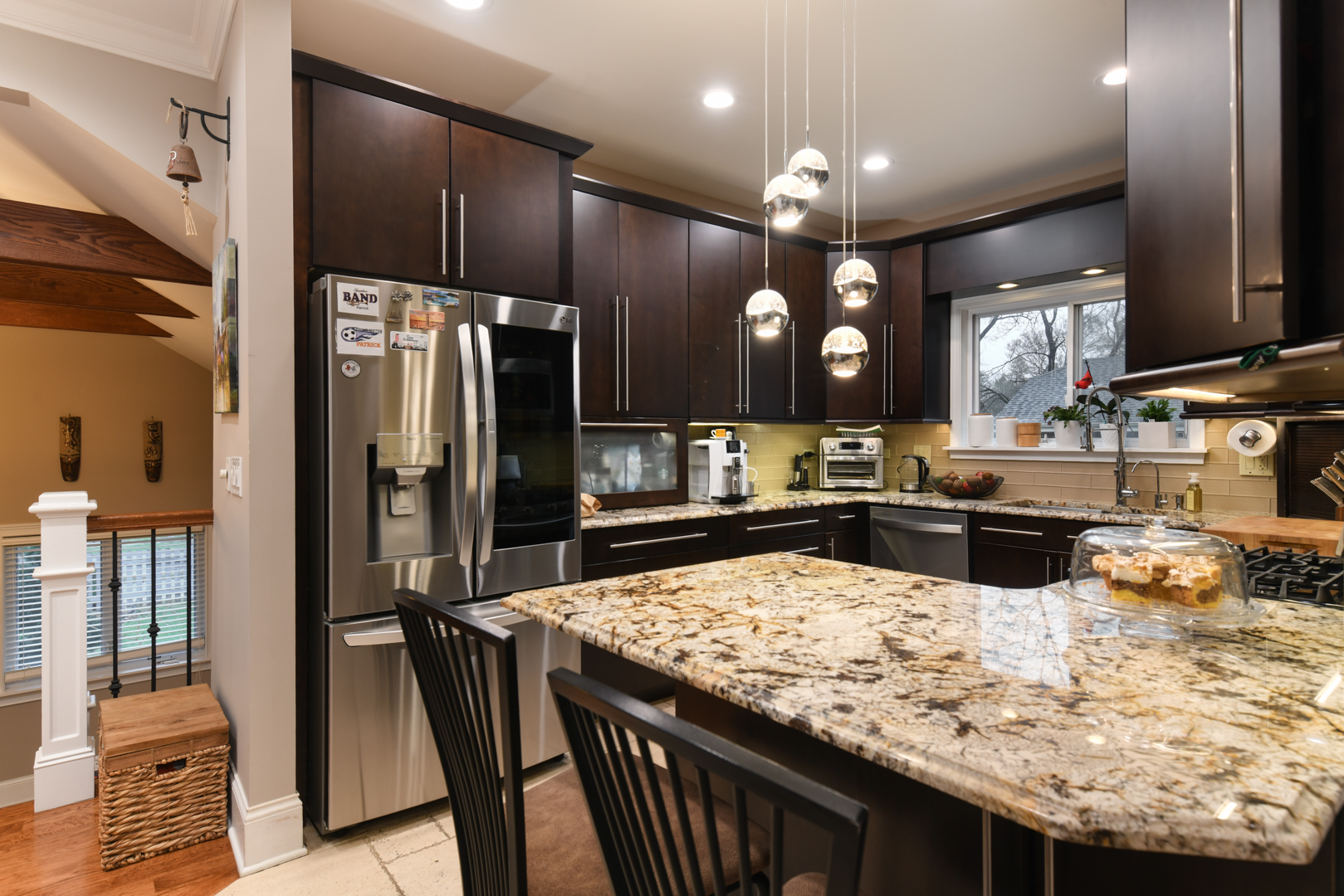 111 Grace Lane Fox River Grove, IL 60021 - Photo 14 of 33 a kitchen with stainless steel appliances kitchen island granite countertop a refrigerator a stove top oven and a sink
