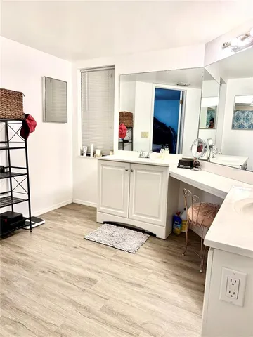 a kitchen with stainless steel appliances kitchen island granite countertop a sink and cabinets