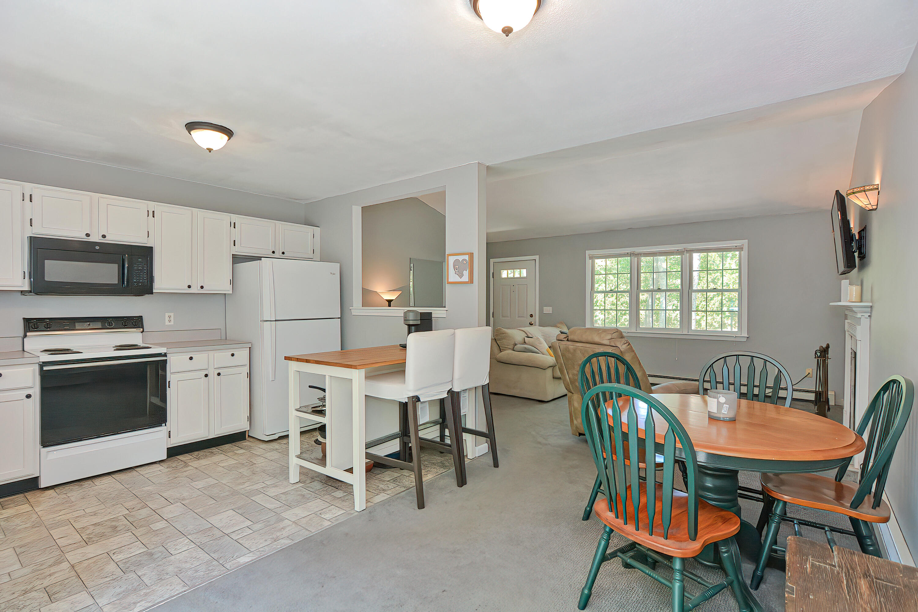 2 King Arthurs Way Buzzards Bay, MA 02532 - Photo 11 of 29 a view of a dining room with furniture and a kitchen
