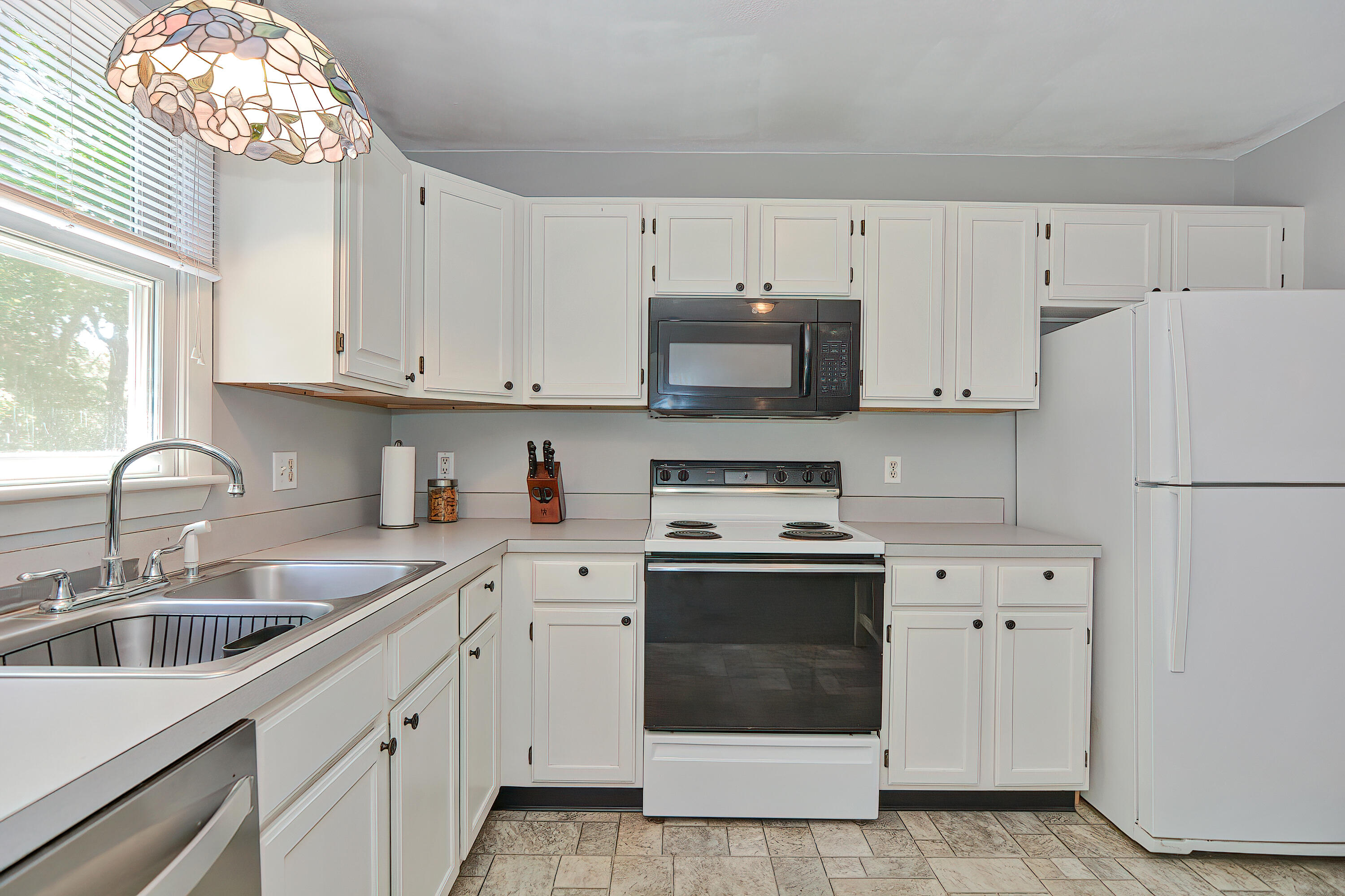 2 King Arthurs Way Buzzards Bay, MA 02532 - Photo 12 of 29 a kitchen with cabinets appliances a sink and a window