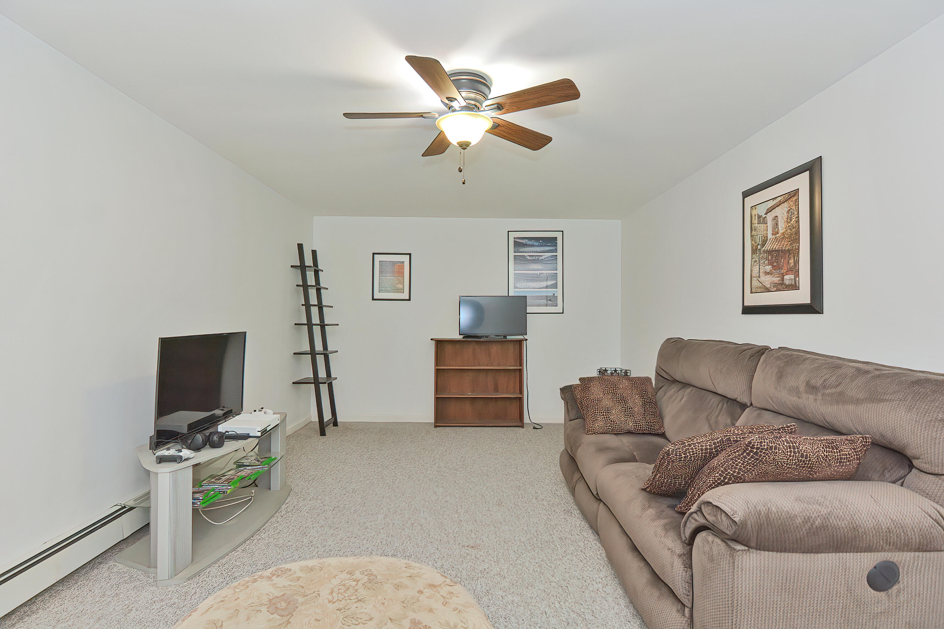 2 King Arthurs Way Buzzards Bay, MA 02532 - Photo 21 of 29 a living room with furniture and a flat screen tv