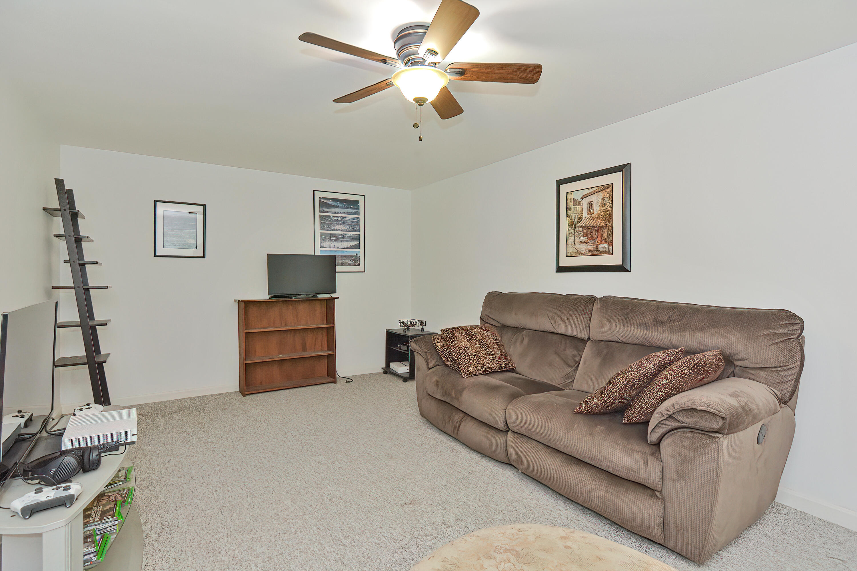 2 King Arthurs Way Buzzards Bay, MA 02532 - Photo 22 of 29 a living room with furniture and a flat screen tv