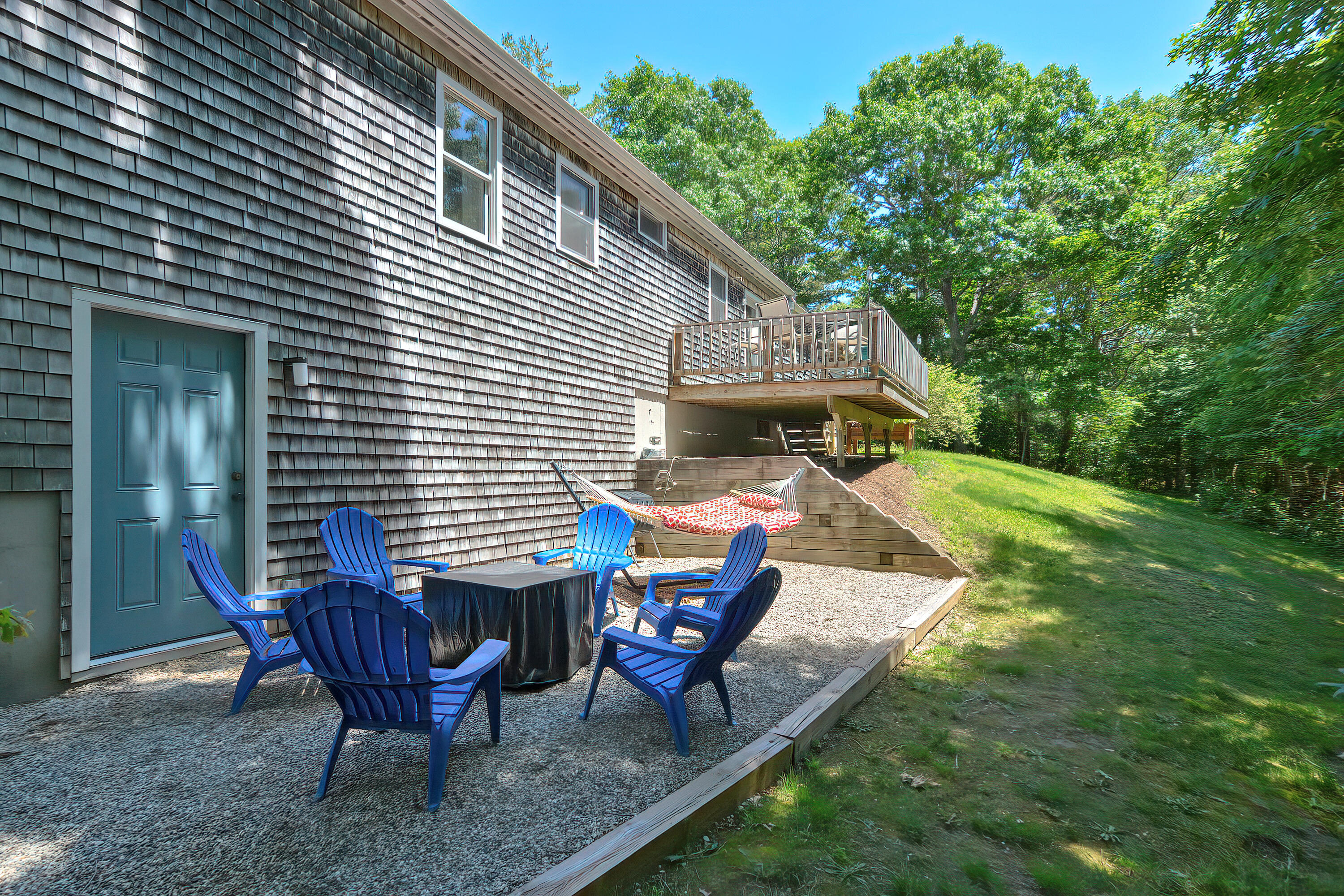 2 King Arthurs Way Buzzards Bay, MA 02532 - Photo 24 of 29 a view of backyard of house with seating space