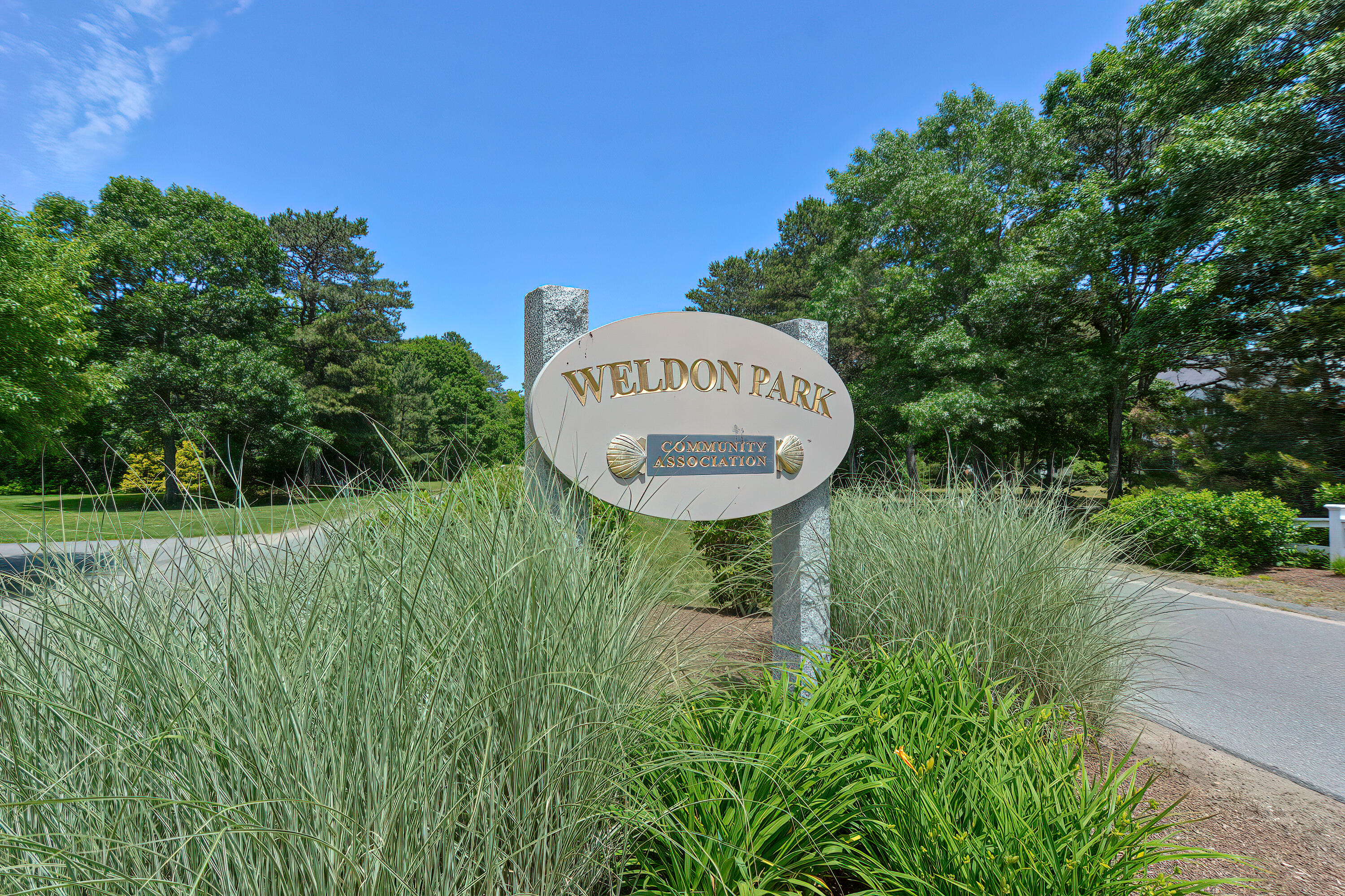 2 King Arthurs Way Buzzards Bay, MA 02532 - Photo 28 of 29 a view of a sign in a garden