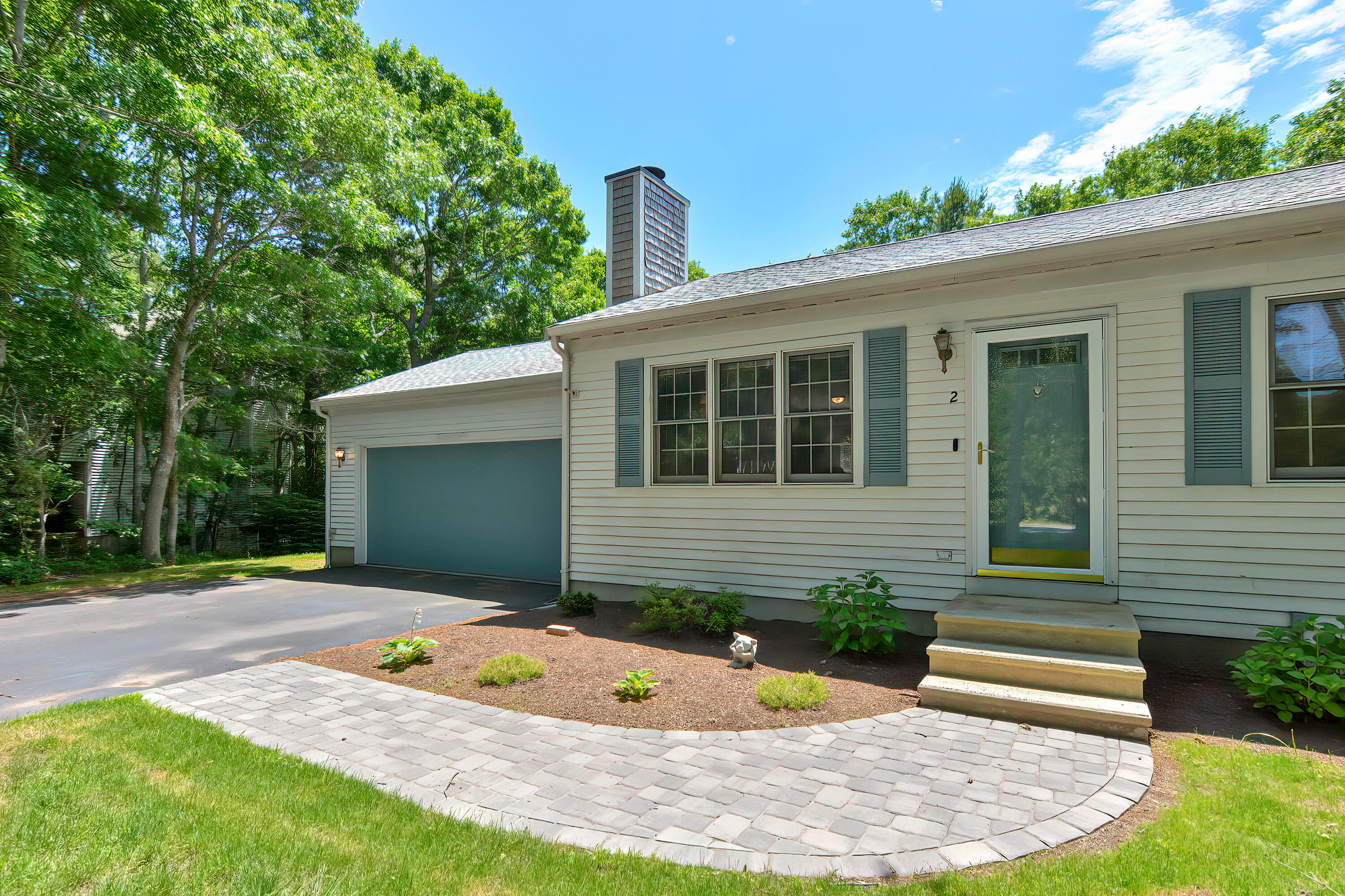 2 King Arthurs Way Buzzards Bay, MA 02532 - Photo 3 of 29 a view of a backyard with a garden and plants