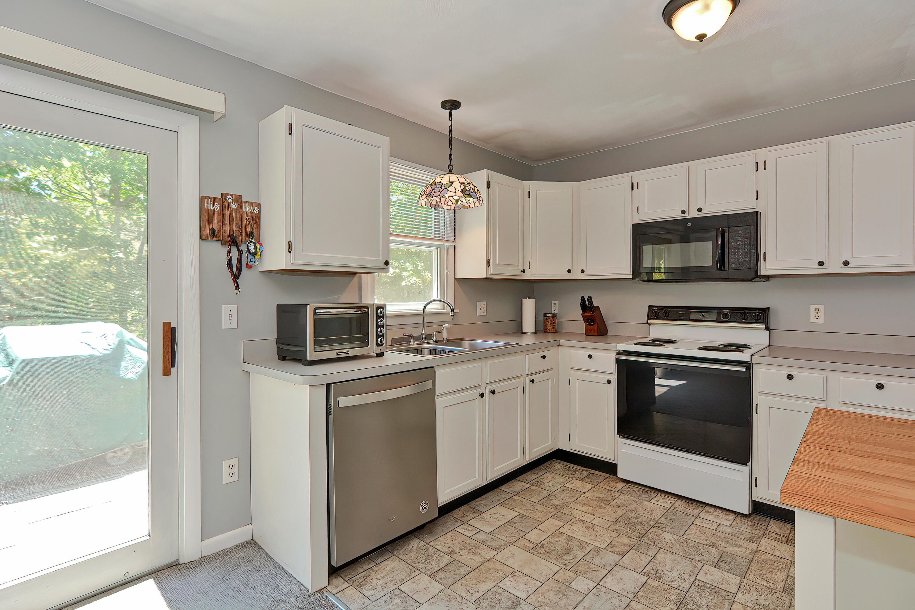 2 King Arthurs Way Buzzards Bay, MA 02532 - Photo 9 of 29 a kitchen with stainless steel appliances granite countertop a stove top oven a sink a counter top space and cabinets