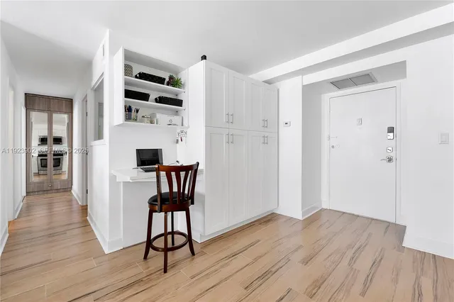 a view of kitchen with furniture and wooden floor
