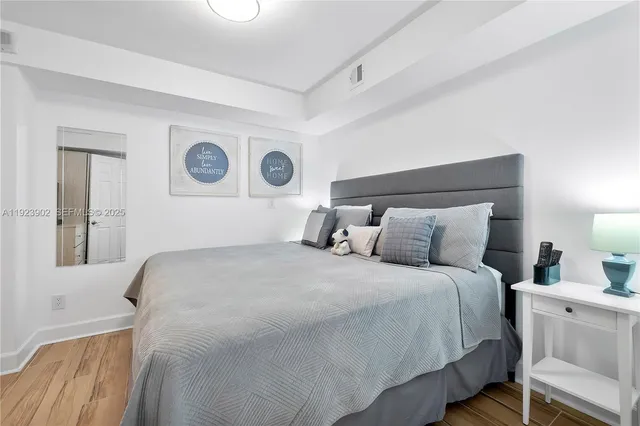 a bedroom with a bed and a chair