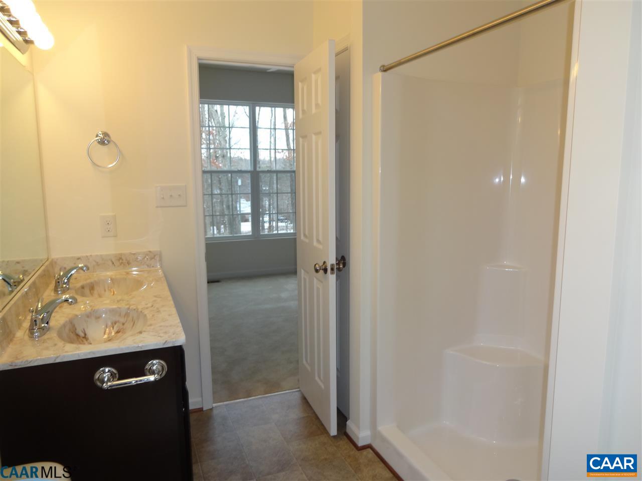 301 East Daffodil Road Ruckersville, VA 22968 - Photo 13 of 26 a bathroom with a sink and shower