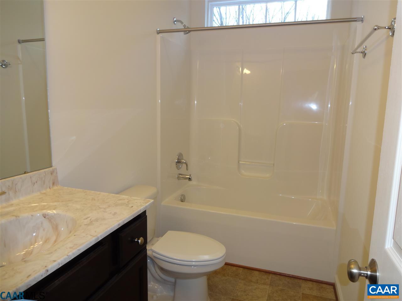 301 East Daffodil Road Ruckersville, VA 22968 - Photo 14 of 26 a bathroom with a sink a toilet and shower