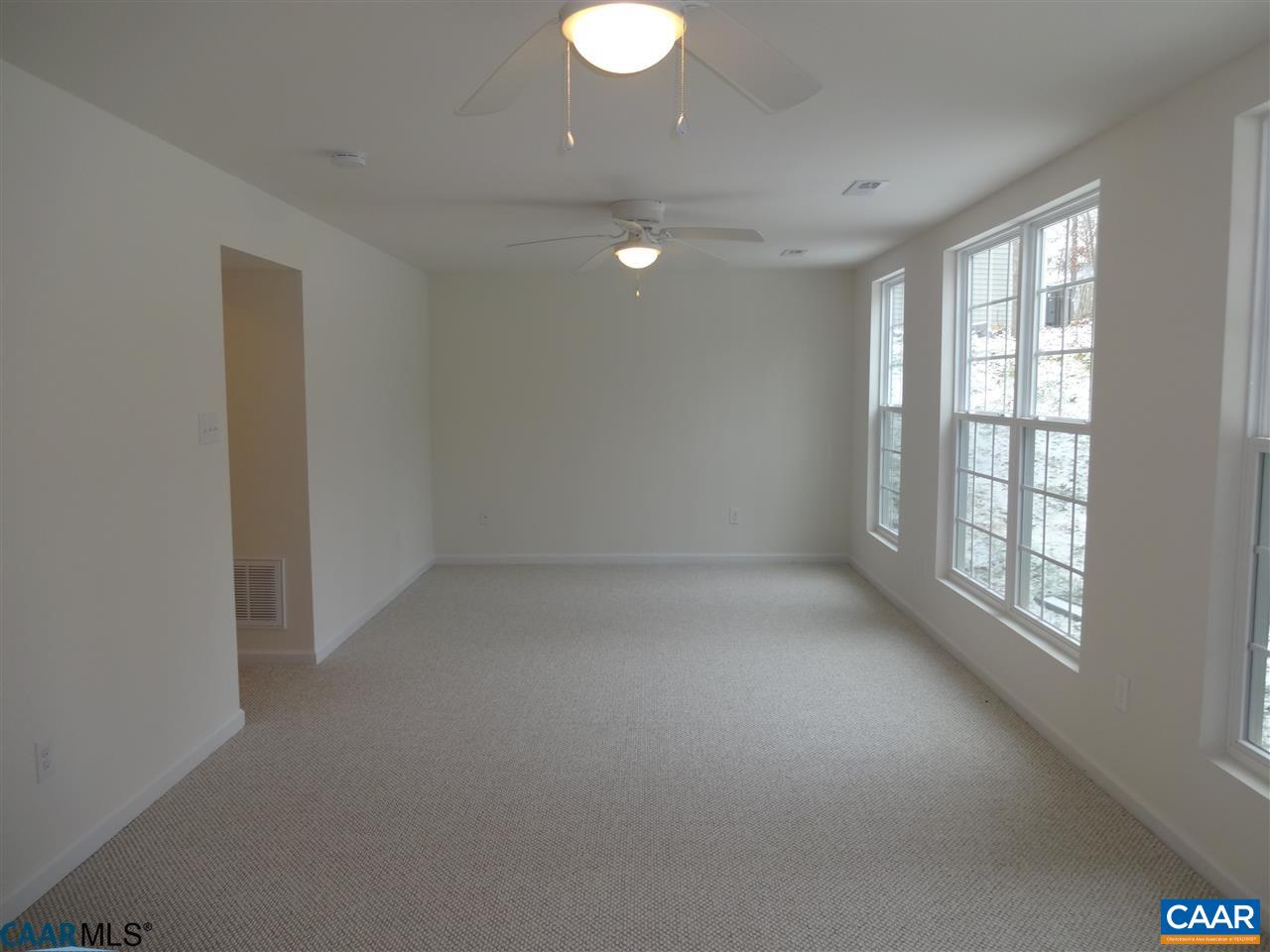 301 East Daffodil Road Ruckersville, VA 22968 - Photo 19 of 26 an empty room with windows and entrance