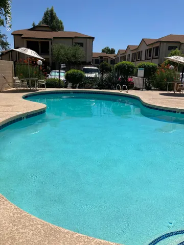 a view of room with window and a ceiling fan