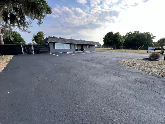 a view of a backyard with sitting area