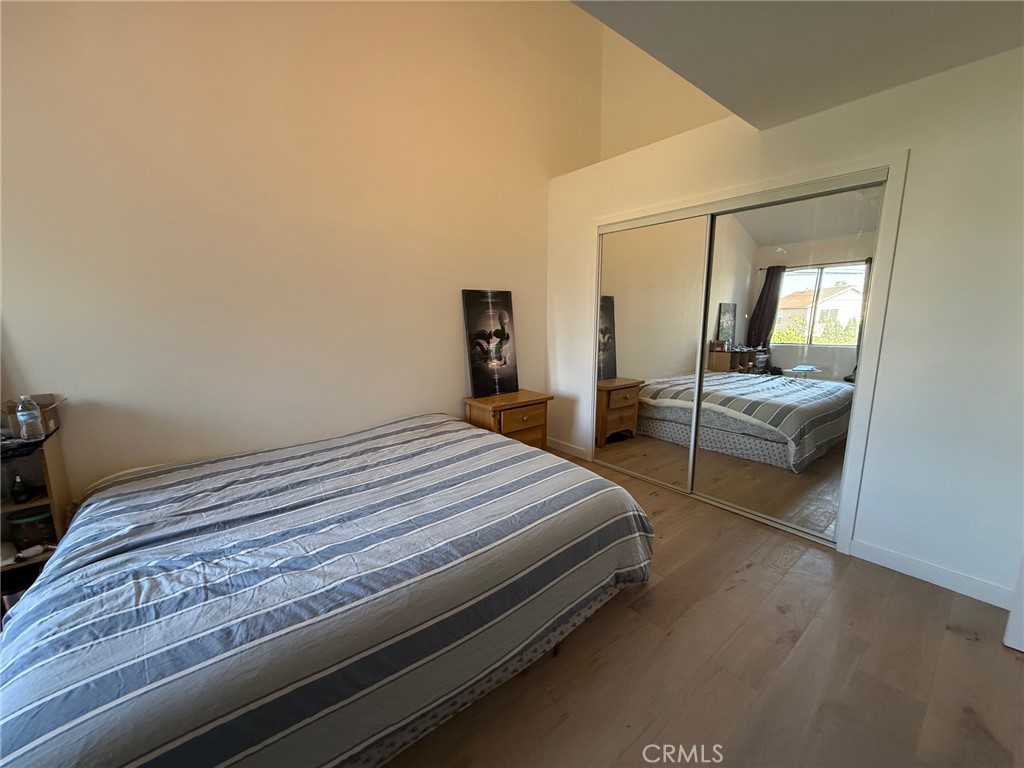 7652 Cerritos Avenue, Unit E Stanton, CA 90680 - Photo 7 of 14 a bedroom with a bed and large mirror