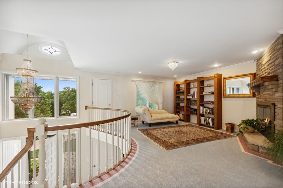 2 Keri Lane Burr Ridge, IL 60527 - Photo 14 of 24 a spacious bedroom with a large bed and a large window