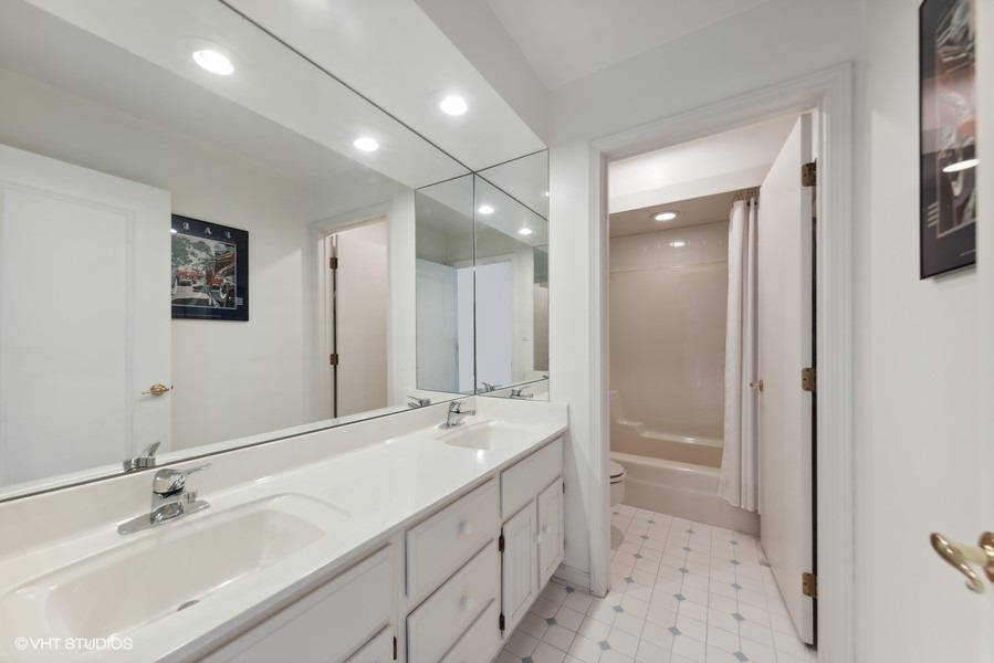 2 Keri Lane Burr Ridge, IL 60527 - Photo 16 of 24 a bathroom with a double vanity sink mirror and double