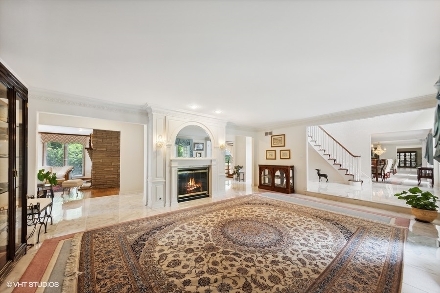 2 Keri Lane Burr Ridge, IL 60527 - Photo 2 of 24 a living room with furniture and a fireplace