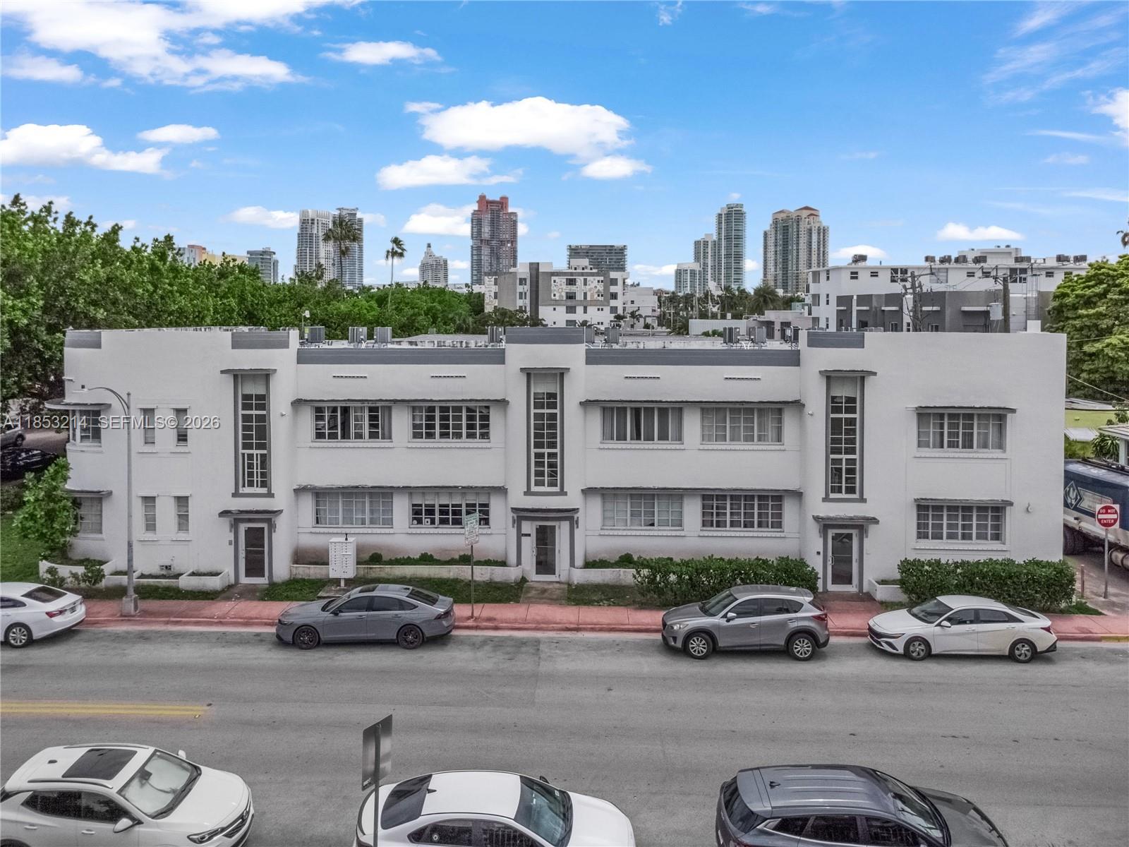 810 7th Street, Unit 107 Miami Beach, FL 33139 - Photo 3 of 36 a view of a street that has couple of cars parked on the road
