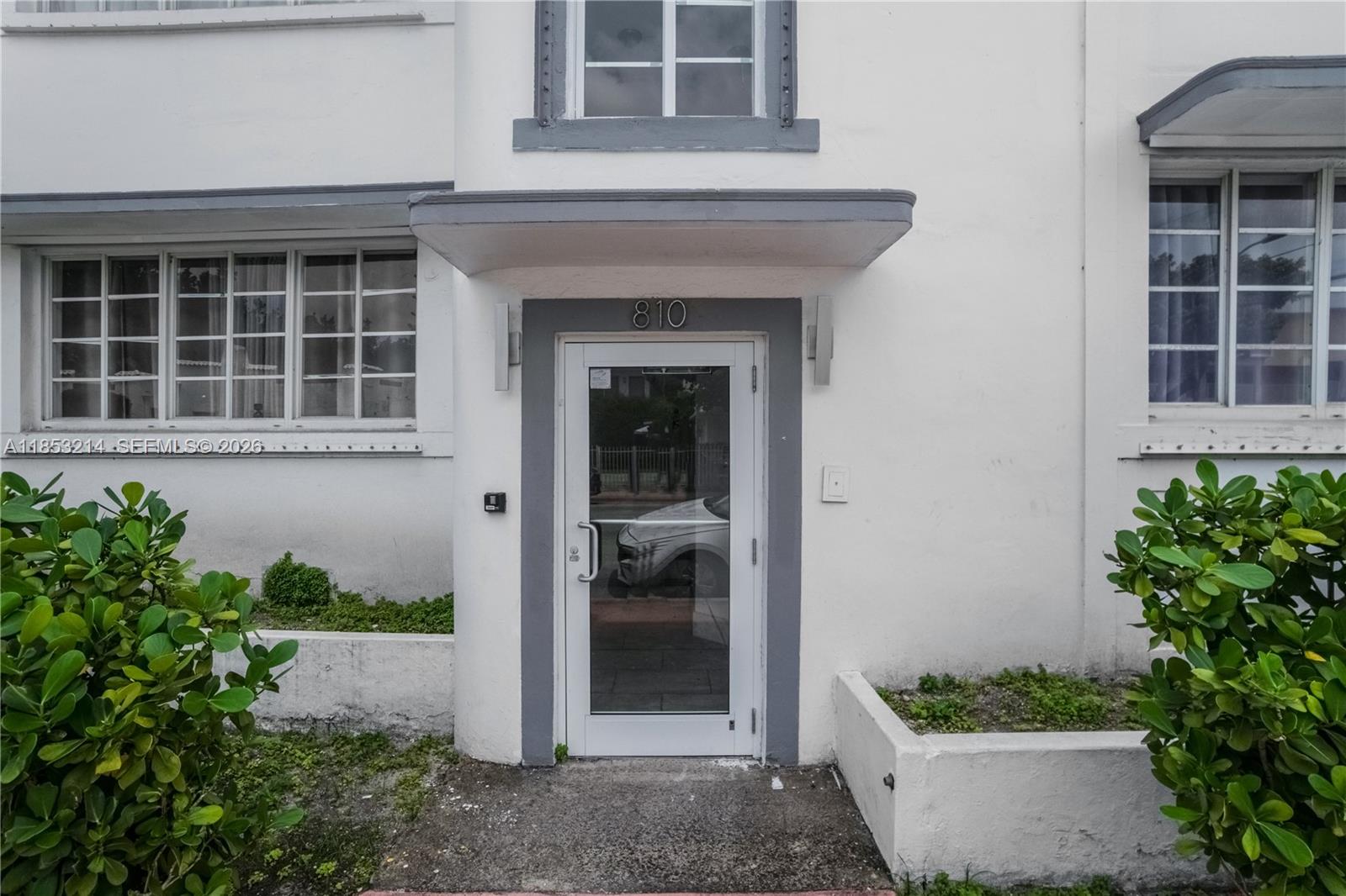 810 7th Street, Unit 107 Miami Beach, FL 33139 - Photo 5 of 36 a front view of a house with a yard