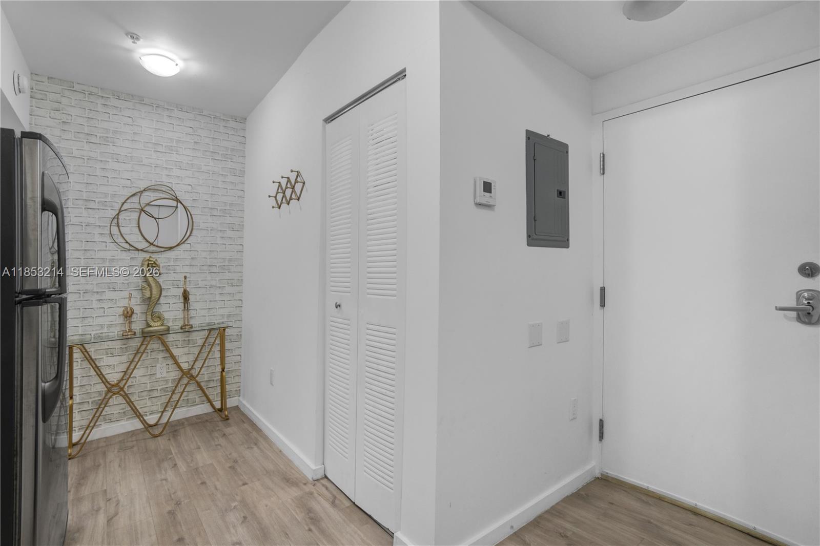 810 7th Street, Unit 107 Miami Beach, FL 33139 - Photo 7 of 36 a view of a hallway with wooden floor