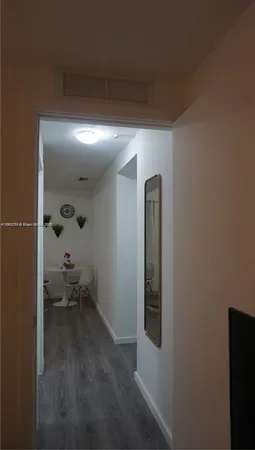 a bedroom with a bed and chair