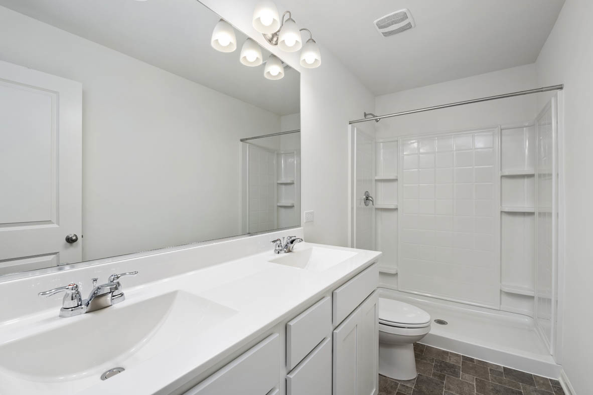3815 Currant Lane Elgin, IL 60124 - Photo 16 of 21 a bathroom with a sink a toilet and shower