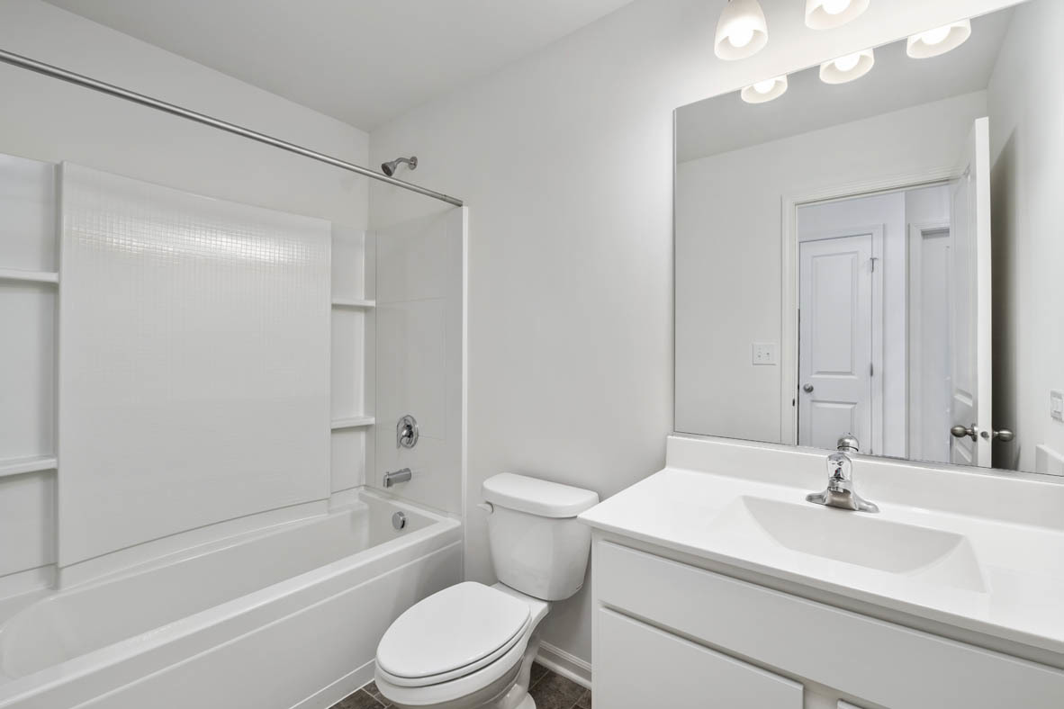 3815 Currant Lane Elgin, IL 60124 - Photo 20 of 21 a bathroom with a sink a toilet and shower