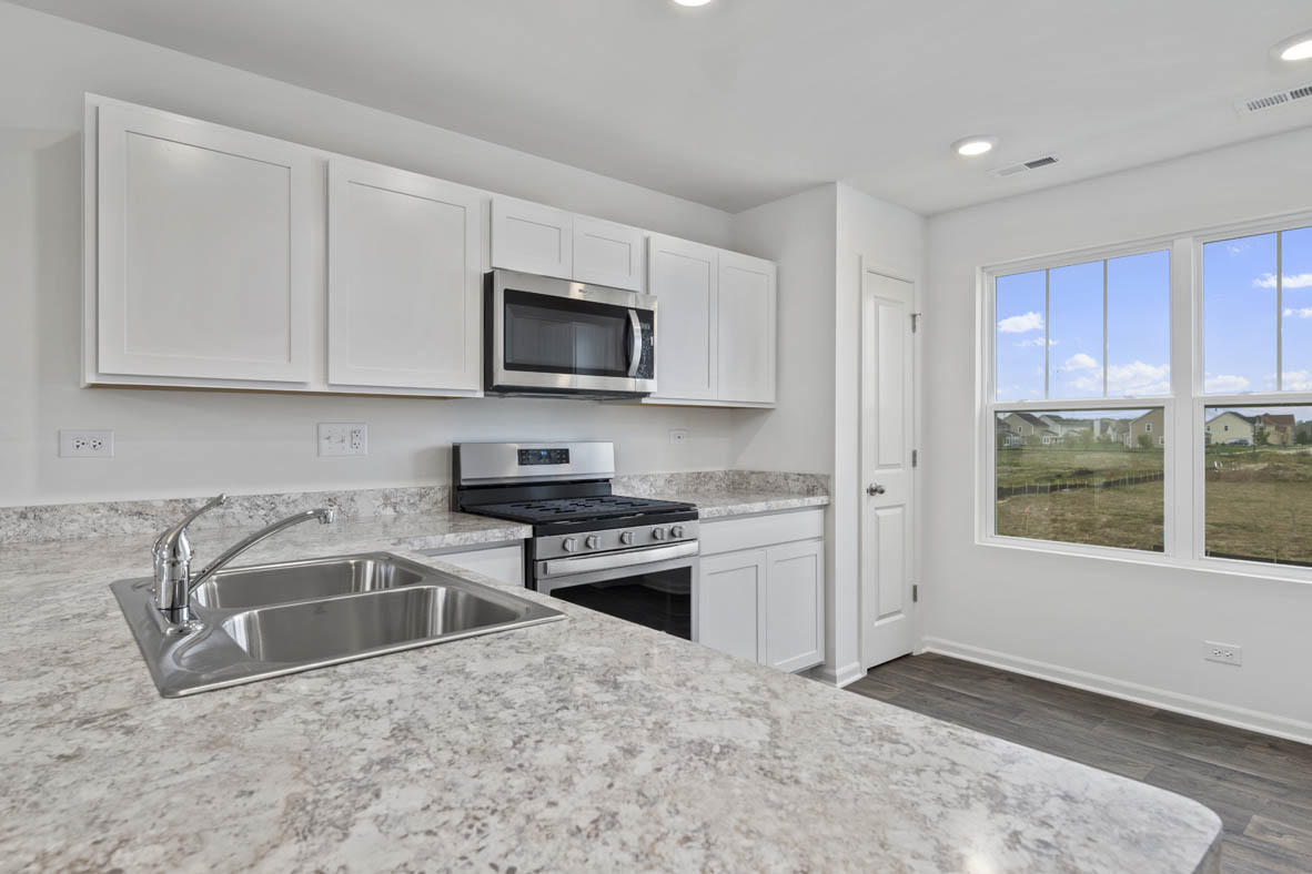 3815 Currant Lane Elgin, IL 60124 - Photo 6 of 21 a kitchen with granite countertop a sink and steel appliances