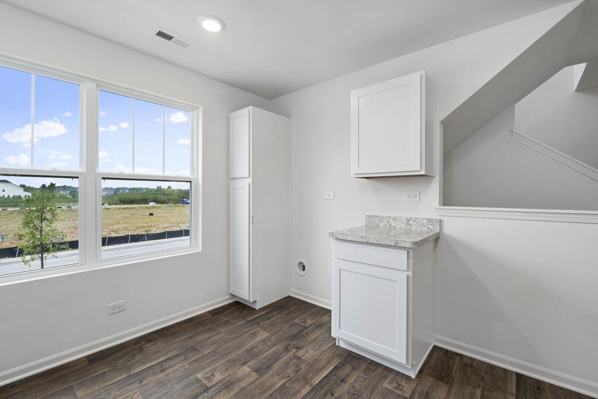 3815 Currant Lane Elgin, IL 60124 - Photo 7 of 21 an empty room with wooden floor and windows