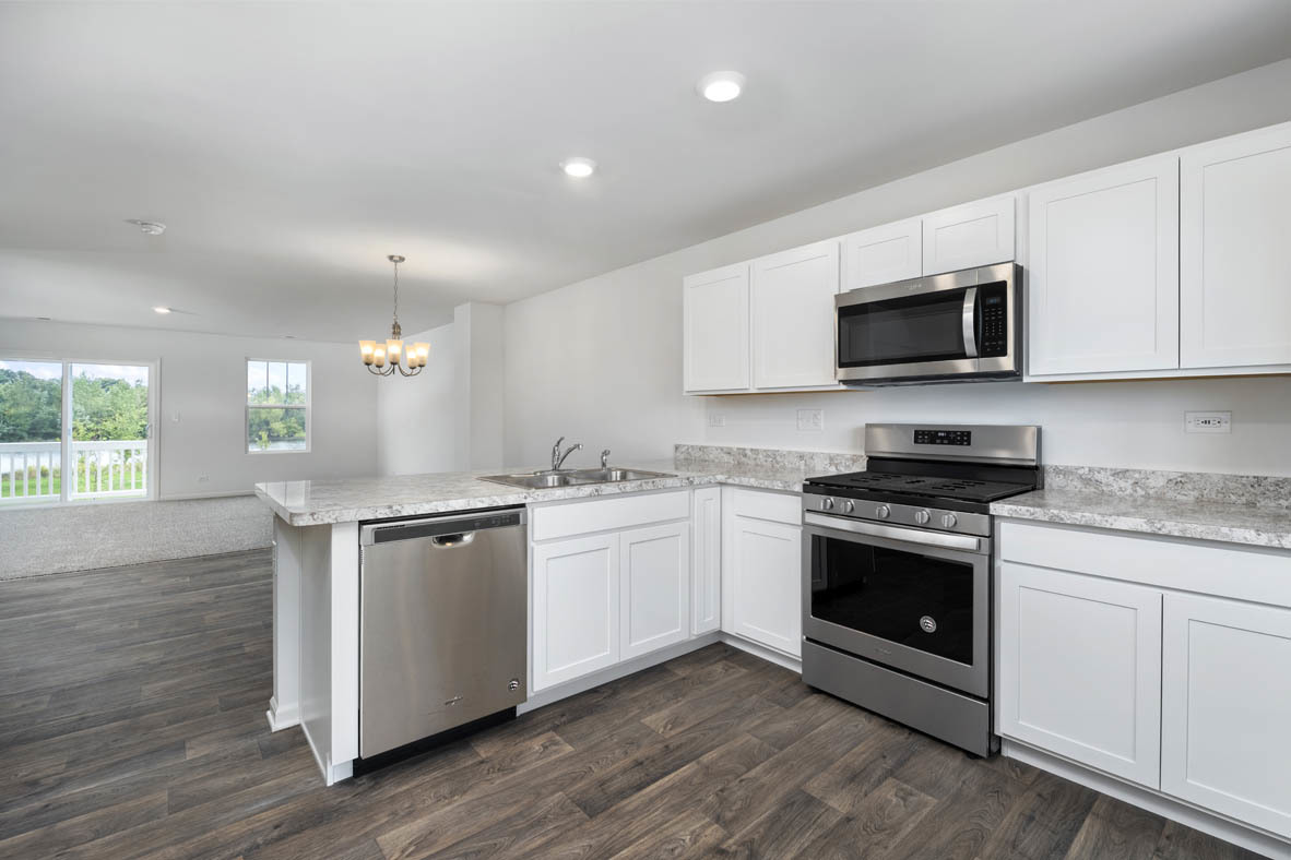 3815 Currant Lane Elgin, IL 60124 - Photo 8 of 21 a kitchen with granite countertop a sink and steel appliances