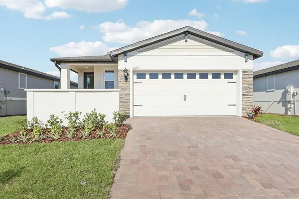 front view of a house with a yard