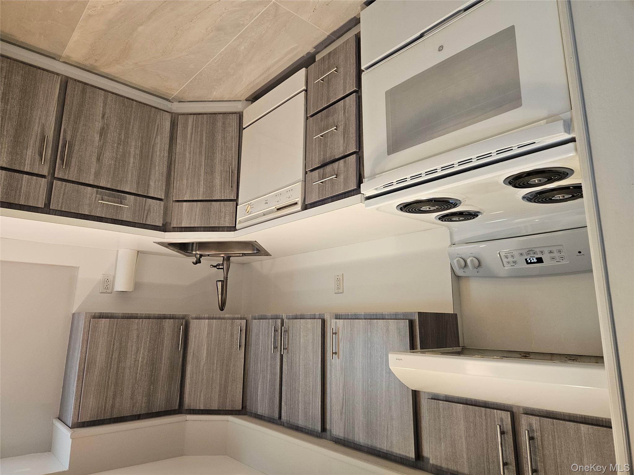 43 Hartman Hill Road Huntington, NY 11743 - Photo 2 of 10 a kitchen with a stove cabinets and a sink