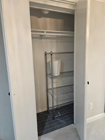 a bathroom with a glass shower door