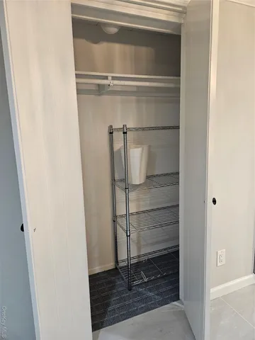 a bathroom with a glass shower door